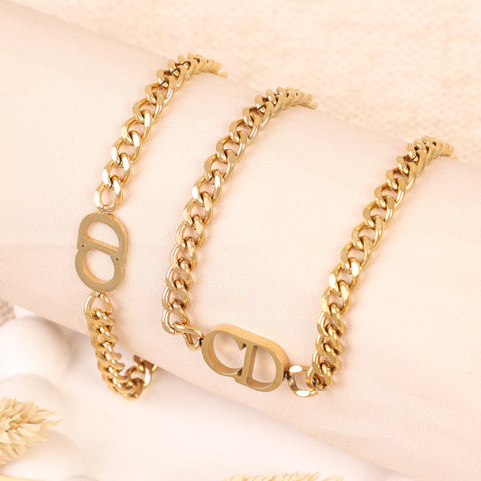 Chunky Gold Curb Chain Bracelet with Monogram Logo